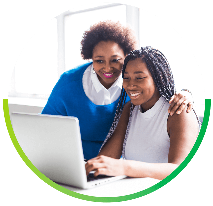 image of mother and daughter using laptop