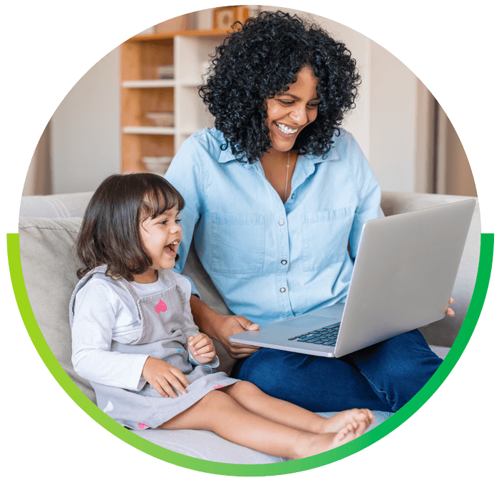 image of mother and daughter using laptop