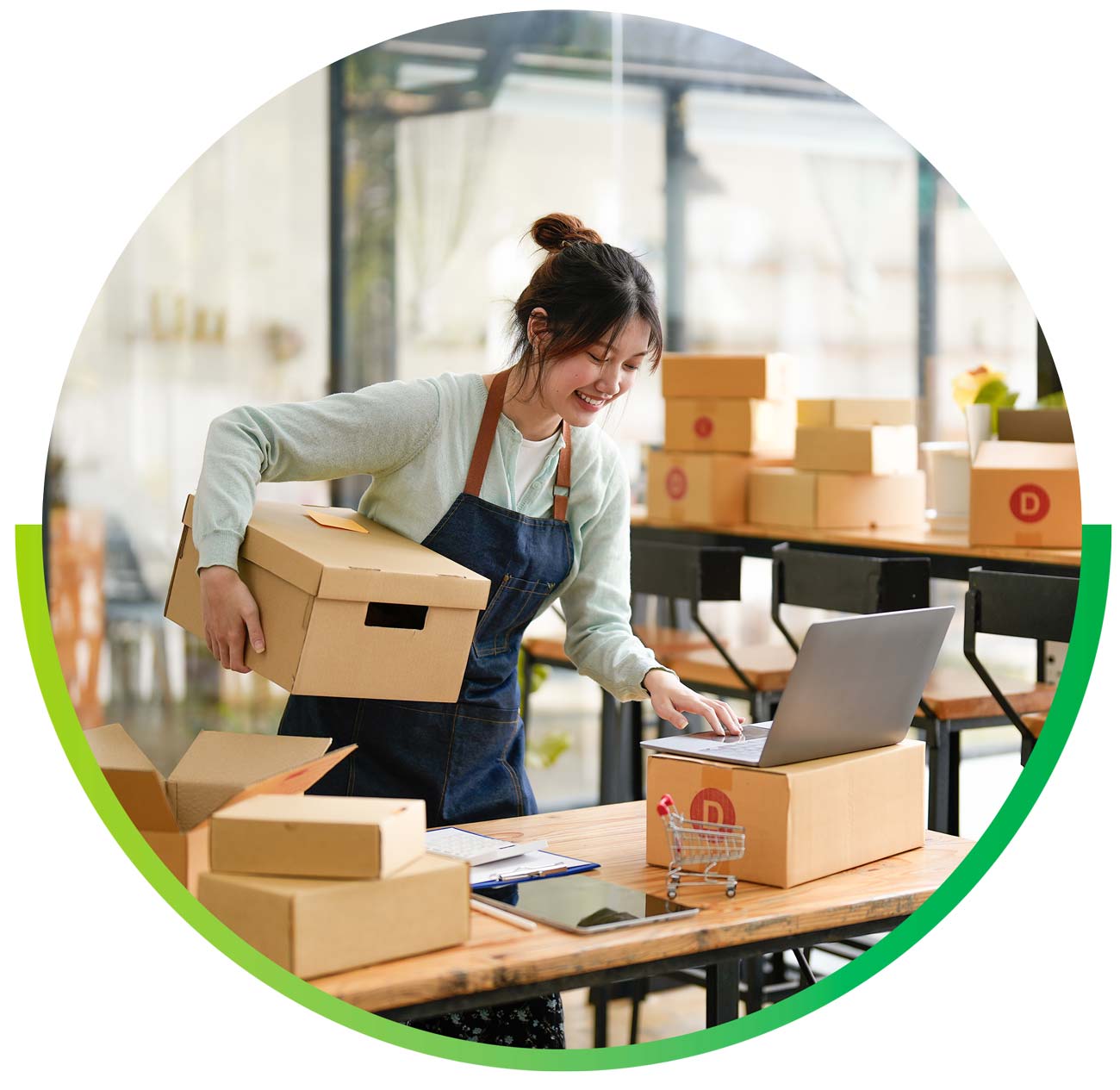 Fidium-Biz-Box-Store Woman using laptop at small business